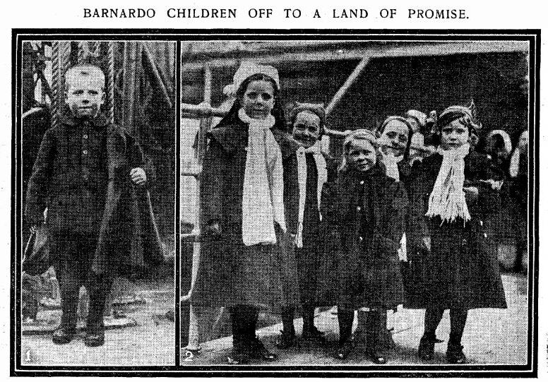 A small group of young girls and a boy, aged five, stand on the deck of a ship. They are wearing winter clothing.